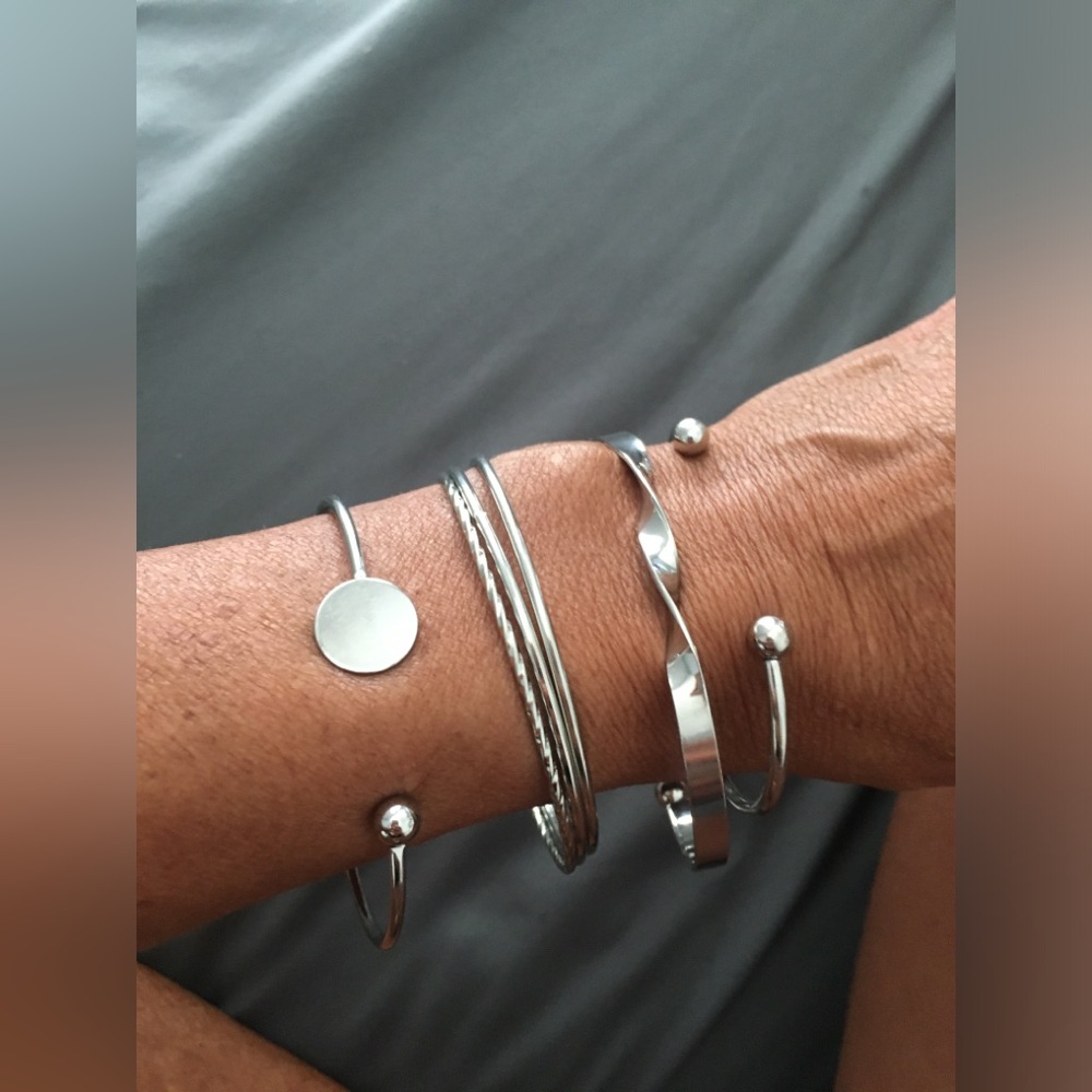 NWOT set of 6 silver bangles, can be worn separately, adjustable.